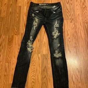 Women’s machine distressed jeans